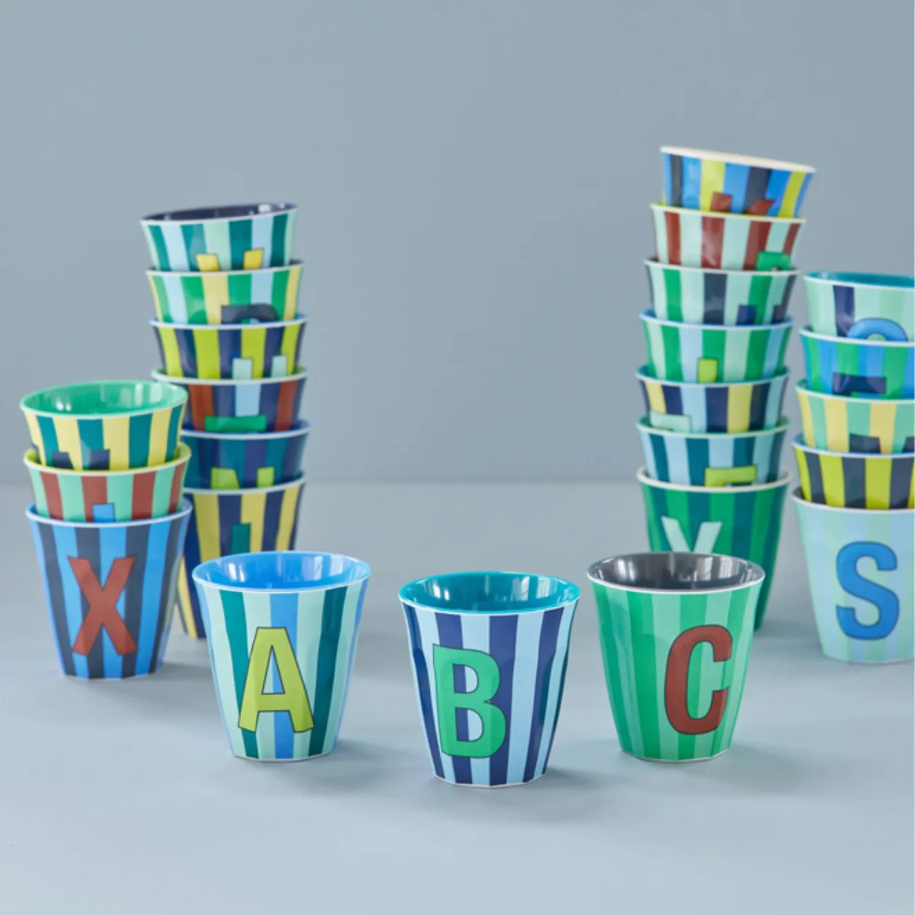 RICE - MELAMINE ALPHABET CUP  MULTI-COLOURED BLUE STRIPES